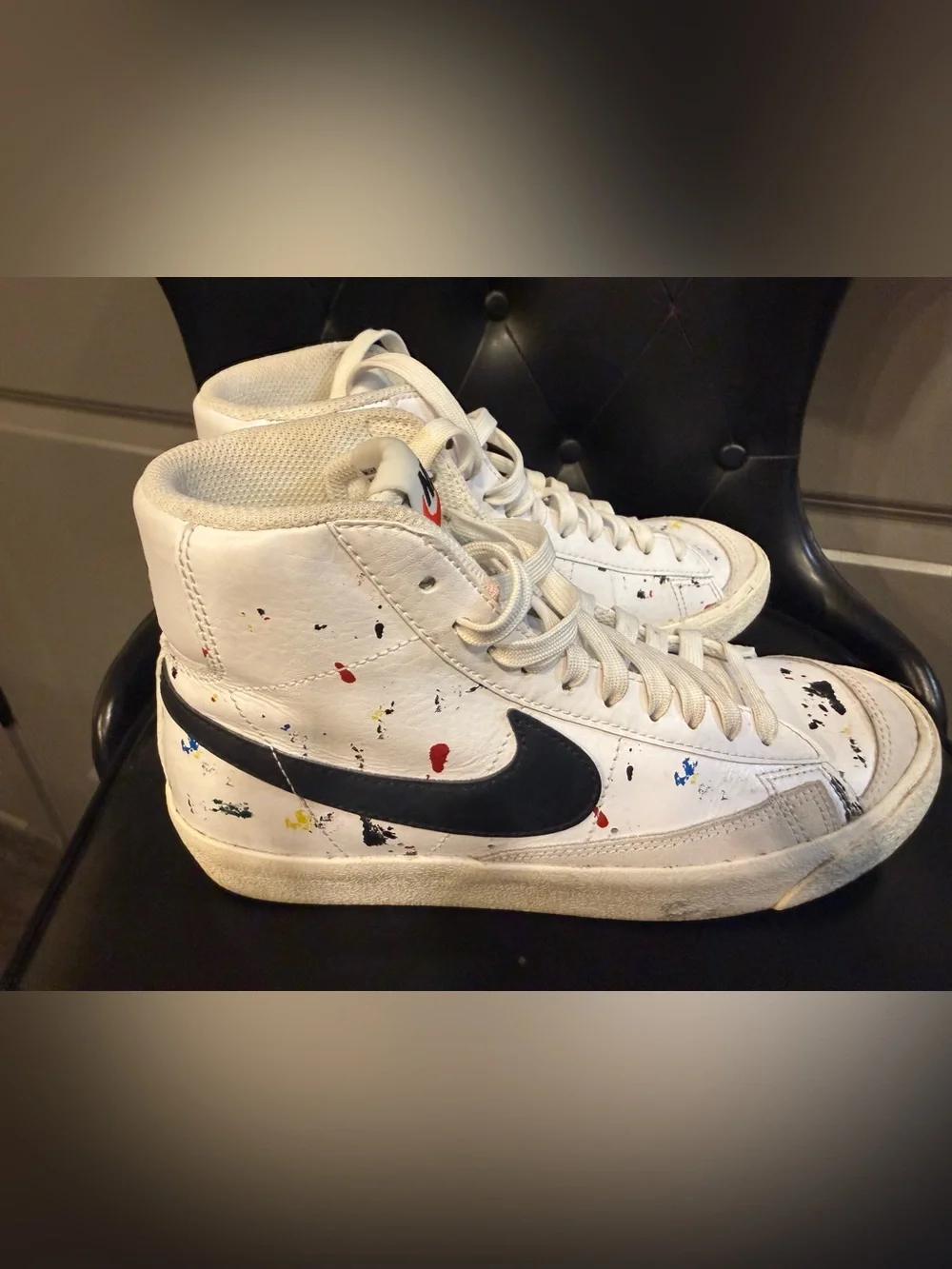 Nike White High-Top Sneakers with Black Swoosh and Paint Splatter